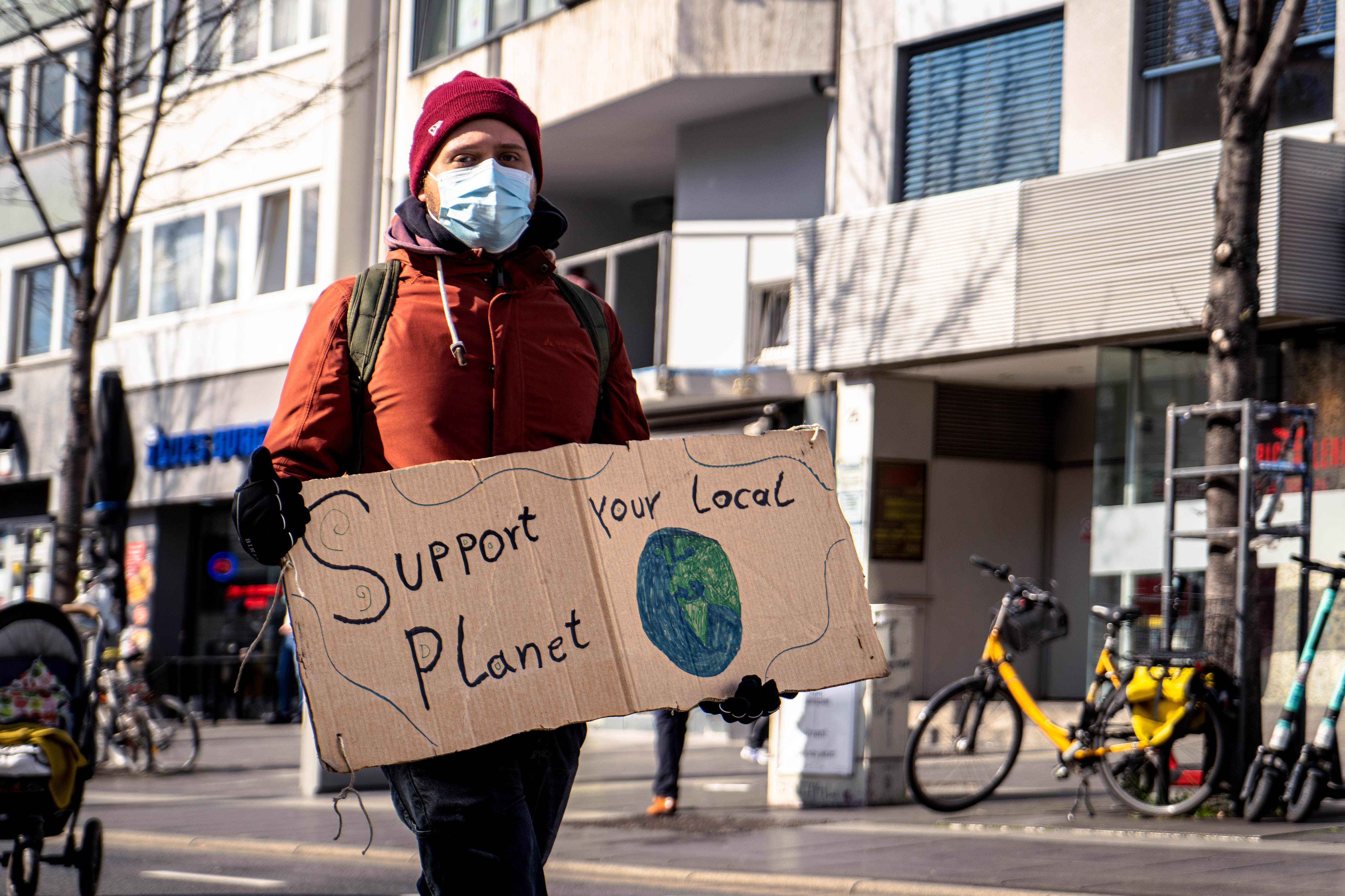 A man holding a banner for climate change