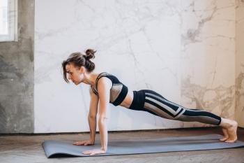 woman in black outfit doing yoga
