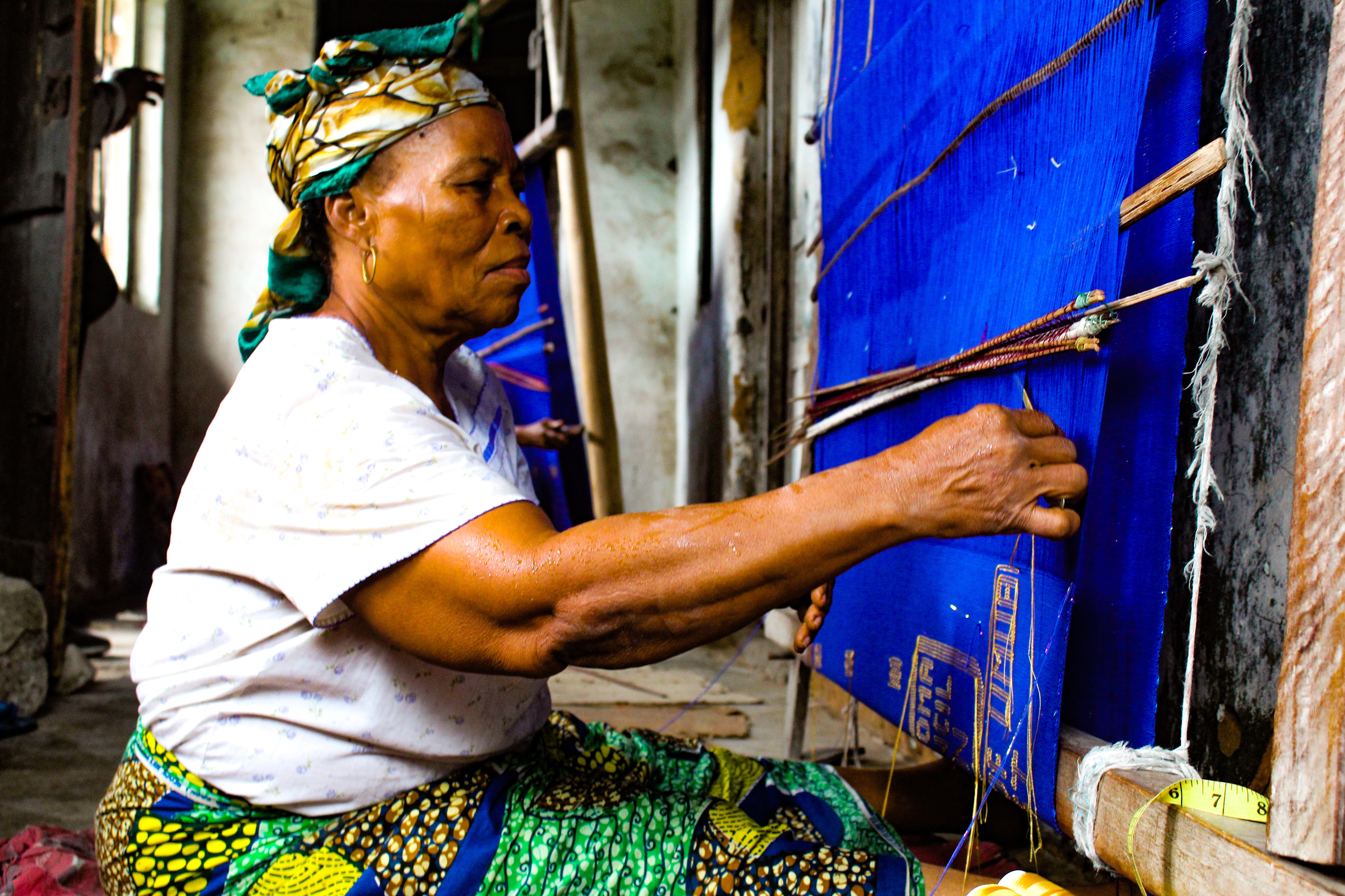a woman with a loom