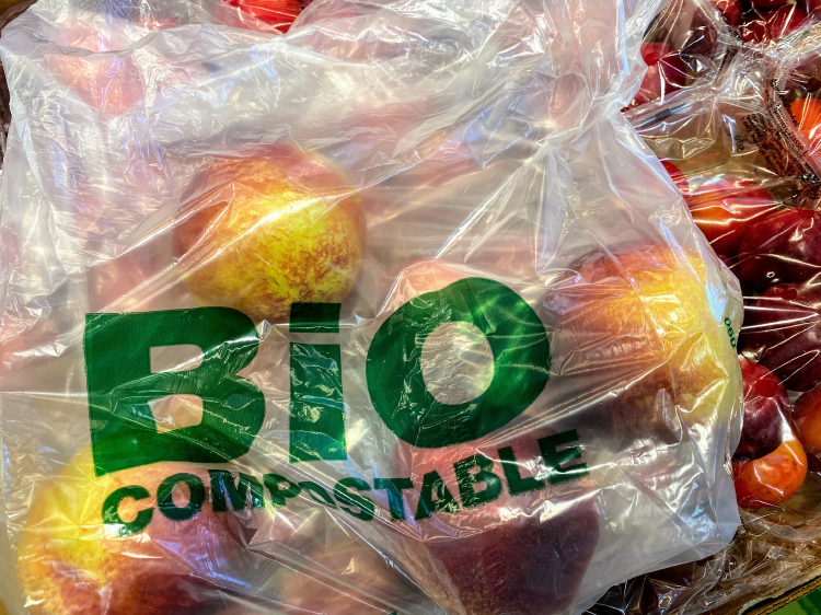 compostable bag compostabe bag filled with red apples