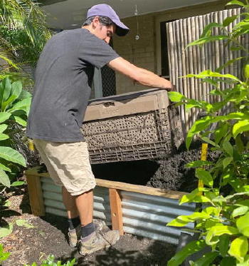Man installing composter Man installing composter