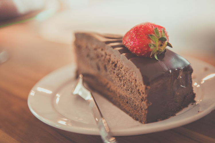 slice of chocolate cake on a white plate