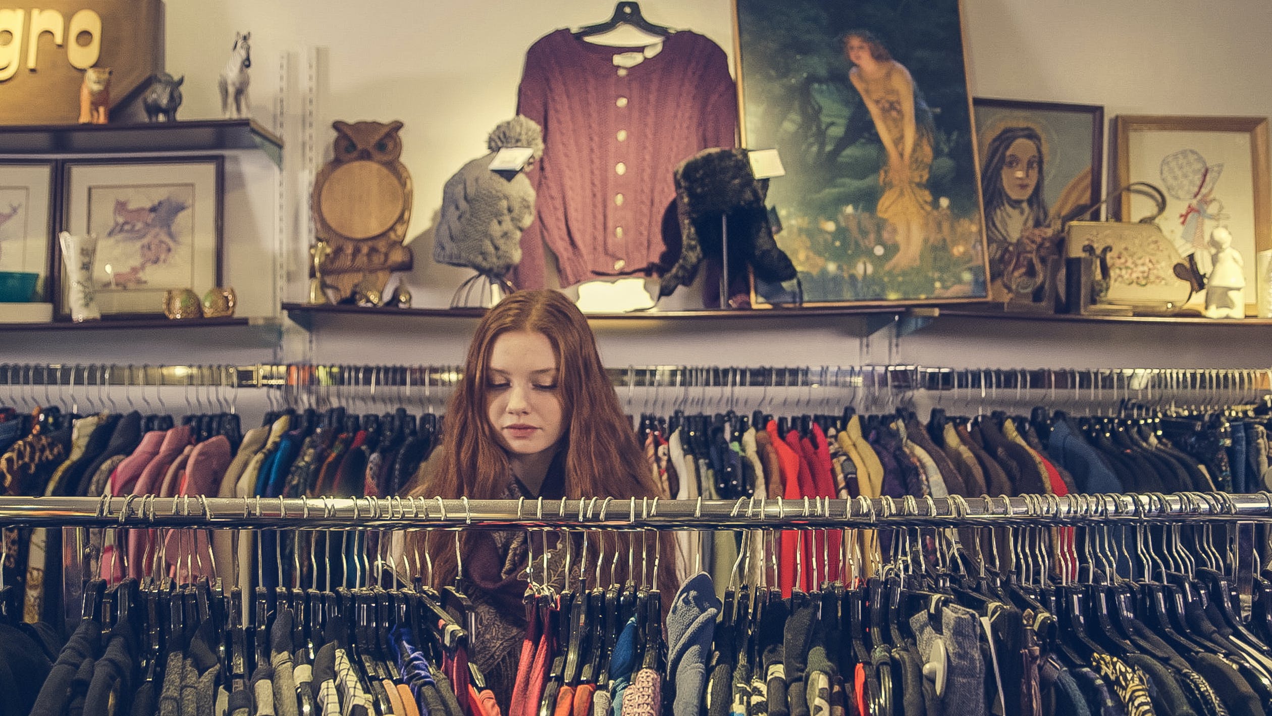 Girl in a second hand clothing shop