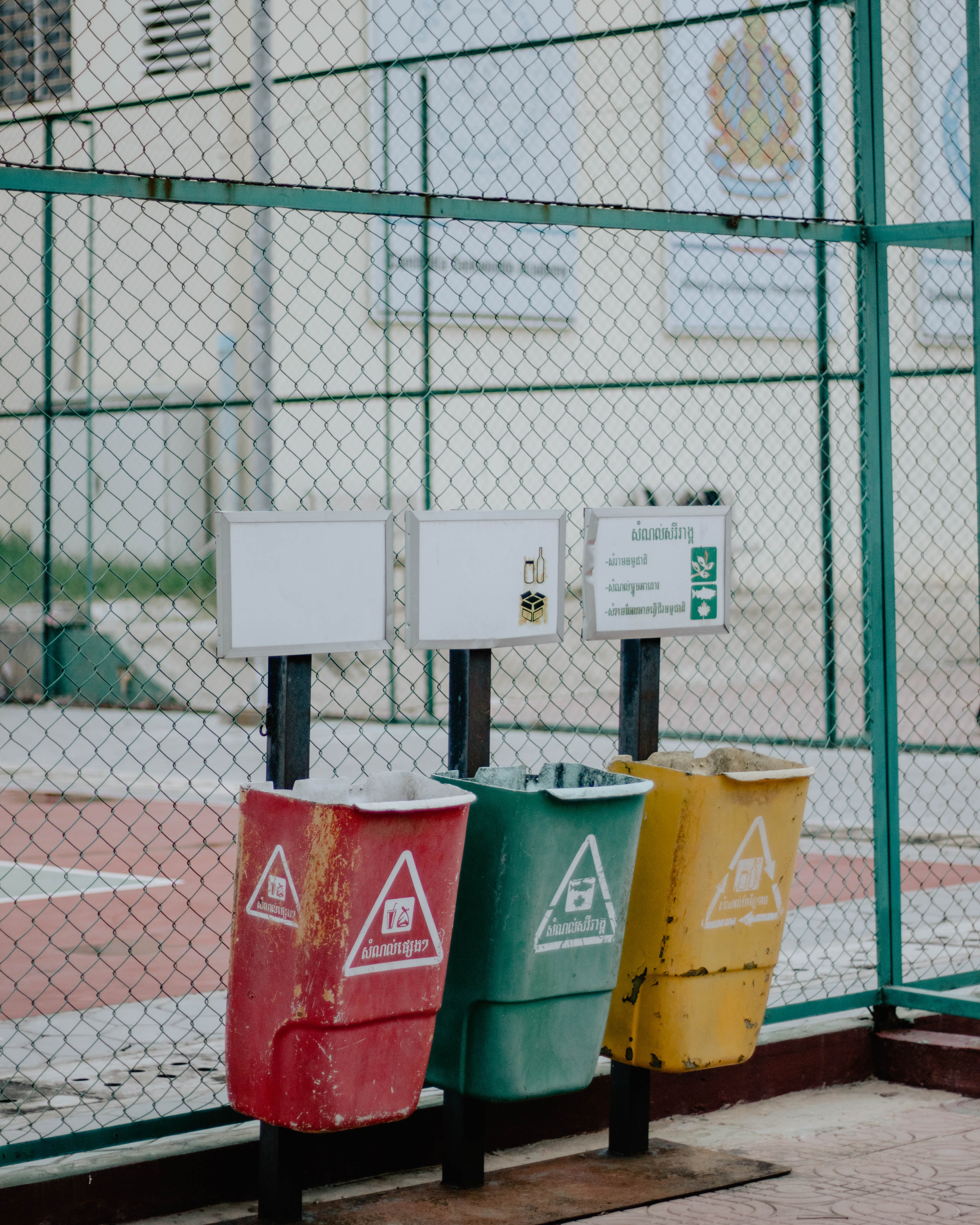 red, green and yellow recycling bins