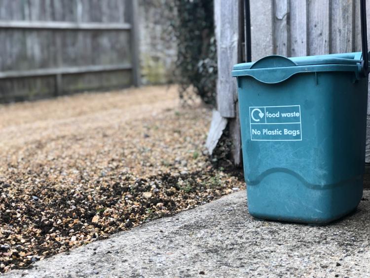 a compost bin on a yard