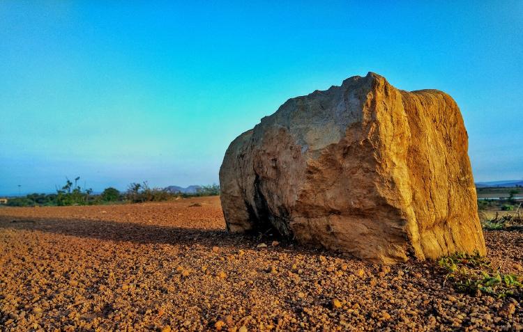 photo-1596733067855-55ba9ba54e30 Rock by the road