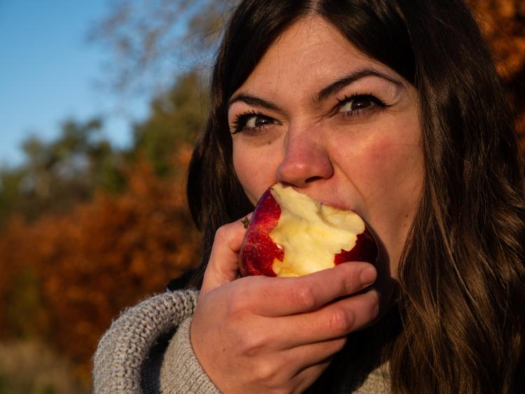 a girl eating an apple