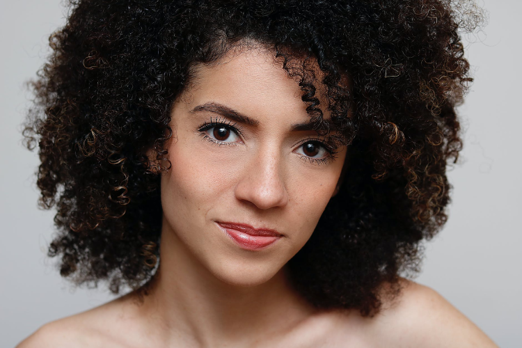 skin portrait photo of curly-haired woman