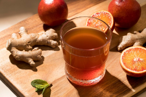 a glass of kefir water with ginger, orange and mint