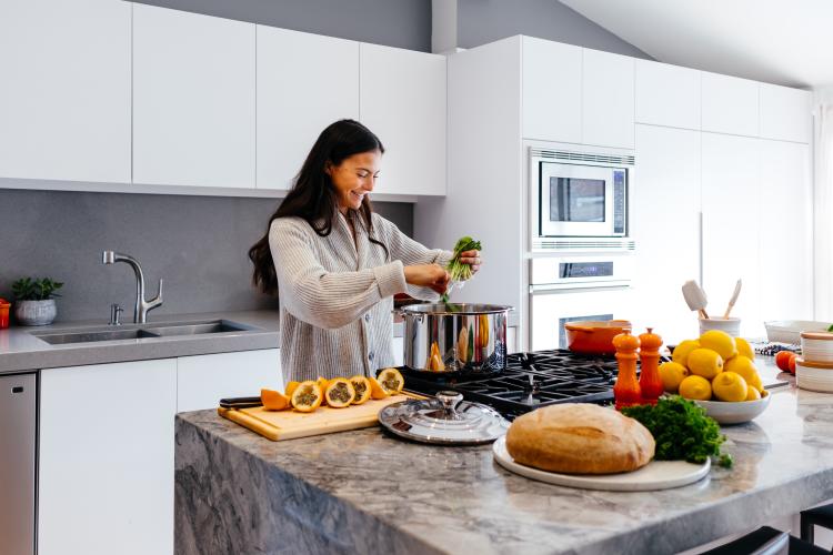 a woman cooking a plant based food