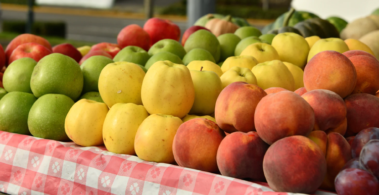 fruit red and green apples, plump and peaches on market